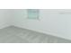 Well-lit bedroom with neutral carpet and a bright window at 306 Wayland Dr, Haines City, FL 33844
