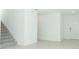 Entryway featuring staircase and white front door at 306 Wayland Dr, Haines City, FL 33844