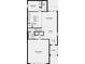 Floor plan of first floor featuring kitchen, living room, dining room, garage, and half bath at 306 Wayland Dr, Haines City, FL 33844