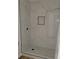 Modern bathroom features a sleek, tiled shower with built-in niche at 3156 Natoma Way, Orlando, FL 32825