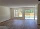 Open concept living room with modern flooring and natural light at 3156 Natoma Way, Orlando, FL 32825