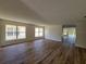 Spacious living room showcasing new flooring, large windows, and plenty of natural light at 3156 Natoma Way, Orlando, FL 32825