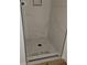 Modern glass shower with marble-style tile and a mosaic-tiled floor at 3156 Natoma Way, Orlando, FL 32825