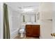 Bathroom featuring tile floors, a shower-tub combo and a wood vanity at 325 Forestway Cir # 104, Altamonte Springs, FL 32701