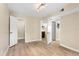 Bedroom featuring hardwood floors, neutral colored walls and access to two bathrooms at 325 Forestway Cir # 104, Altamonte Springs, FL 32701