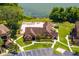 Aerial view of a charming clubhouse with a pool and lounge area by a serene lake at 325 Forestway Cir # 104, Altamonte Springs, FL 32701