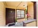Inviting condo entrance with a welcome mat and well-lit porch at 325 Forestway Cir # 104, Altamonte Springs, FL 32701