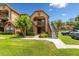 Charming condo building with a well-manicured lawn and lush landscaping at 325 Forestway Cir # 104, Altamonte Springs, FL 32701