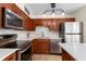 Well-equipped kitchen with stainless steel appliances and sleek countertops at 325 Forestway Cir # 104, Altamonte Springs, FL 32701