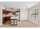 Bright kitchen featuring stainless steel appliances, wood cabinets, and a stylish island at 325 Forestway Cir # 104, Altamonte Springs, FL 32701