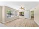 Inviting living room with large windows and contemporary flooring at 325 Forestway Cir # 104, Altamonte Springs, FL 32701