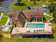 Aerial view of the clubhouse pool and jacuzzi with lounge chairs for relaxing on a sunny day at 325 Forestway Cir # 104, Altamonte Springs, FL 32701