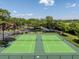 Aerial view of meticulously maintained tennis courts, perfect for active community members at 325 Forestway Cir # 104, Altamonte Springs, FL 32701