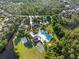 Aerial view showcasing community pool, tennis courts, recreational facilities, and green spaces at 3400 Rose Mallow Loop, Oviedo, FL 32766
