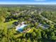Aerial view of community amenities including a pool, clubhouse, tennis courts and recreational fields at 3400 Rose Mallow Loop, Oviedo, FL 32766