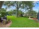 Spacious backyard with lush green lawn, mature trees, and fence creating a private outdoor space at 3400 Rose Mallow Loop, Oviedo, FL 32766