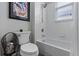 Bathroom featuring a toilet, tub and shower combination with white tile walls at 3400 Rose Mallow Loop, Oviedo, FL 32766