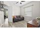 Cozy bedroom with a comfortable couch, natural light, and neutral decor at 3400 Rose Mallow Loop, Oviedo, FL 32766