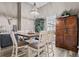Bright dining room with a chandelier and large window that brings in natural lighting at 3400 Rose Mallow Loop, Oviedo, FL 32766