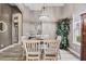 Charming dining room with stylish lighting, a classic table setting, and comfortable seating for meals at 3400 Rose Mallow Loop, Oviedo, FL 32766
