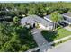 Well-maintained single-Gathering home with a manicured lawn, mature trees, and an elegant brick driveway at 3400 Rose Mallow Loop, Oviedo, FL 32766
