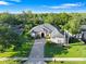 Beautiful single-Gathering home featuring lush landscaping and a welcoming brick driveway and walkway at 3400 Rose Mallow Loop, Oviedo, FL 32766