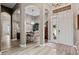Open-concept foyer leading into the dining room with wood floors and neutral decor at 3400 Rose Mallow Loop, Oviedo, FL 32766