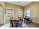 Cozy game room featuring tables, chairs and natural lighting from multiple windows at 3400 Rose Mallow Loop, Oviedo, FL 32766
