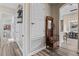 Hallway with storage shelves and a decorative bench at 3400 Rose Mallow Loop, Oviedo, FL 32766