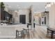 Open concept kitchen with bar seating that flows into the dining and living areas at 3400 Rose Mallow Loop, Oviedo, FL 32766