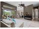 Spacious living room with elegant decor, access to outdoor living, and a welcoming ambiance at 3400 Rose Mallow Loop, Oviedo, FL 32766