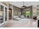 Open living space featuring elegant seating, access to outdoor patio, and flowing floor plan at 3400 Rose Mallow Loop, Oviedo, FL 32766