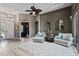 Elegant living room showcasing plush seating, stylish decor, and an abundance of natural light at 3400 Rose Mallow Loop, Oviedo, FL 32766