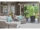 Cozy living room featuring comfortable seating, elegant decor, and serene views of the outdoors at 3400 Rose Mallow Loop, Oviedo, FL 32766