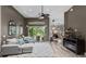 Bright living area showcasing stylish furnishings, natural light, and a seamless flow to the patio at 3400 Rose Mallow Loop, Oviedo, FL 32766