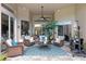 Inviting covered patio with comfortable seating, ceiling fan, and a calming outdoor living space at 3400 Rose Mallow Loop, Oviedo, FL 32766