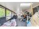 Enclosed back porch containing assorted items, furniture, and equipment at 3711 Shady Grove Cir, Orlando, FL 32810