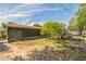 View of the backyard with a trampoline and enclosed patio area at 3711 Shady Grove Cir, Orlando, FL 32810