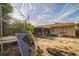 Backyard featuring a trampoline, enclosed porch, and sparse landscaping at 3711 Shady Grove Cir, Orlando, FL 32810