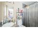 Bathroom featuring a single sink vanity, a mirror, and a shower with a curtain at 3711 Shady Grove Cir, Orlando, FL 32810