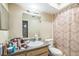 Cozy bathroom featuring a vanity with countertop, mirror, and patterned shower curtain at 3711 Shady Grove Cir, Orlando, FL 32810