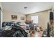 Bedroom with wood flooring, a window, and neutral colored walls at 3711 Shady Grove Cir, Orlando, FL 32810