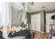 Bedroom with wood flooring and neutral walls, featuring a double door closet at 3711 Shady Grove Cir, Orlando, FL 32810