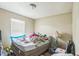 Bedroom with wood floors, a window with blinds, and neutral walls at 3711 Shady Grove Cir, Orlando, FL 32810