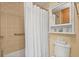 Cozy bathroom featuring tile and a white shower curtain in a well-maintained space at 38 Da Rosa Ave, Debary, FL 32713