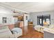 Open-concept kitchen and living area with hardwood floors and plenty of natural light at 38 Da Rosa Ave, Debary, FL 32713
