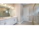 Bathroom featuring dual sinks, a shower, and stylish fixtures at 4204 Barbuda Ln, Kissimmee, FL 34758