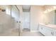 Bathroom featuring a glass enclosed shower, double vanity, and modern finishes at 4204 Barbuda Ln, Kissimmee, FL 34758