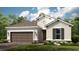 Attractive single-story home with a brown roof, tan stucco siding, and a two-car garage at 4204 Barbuda Ln, Kissimmee, FL 34758