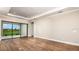 Spacious living room with wood flooring and sliding glass doors to outdoor space at 4204 Barbuda Ln, Kissimmee, FL 34758